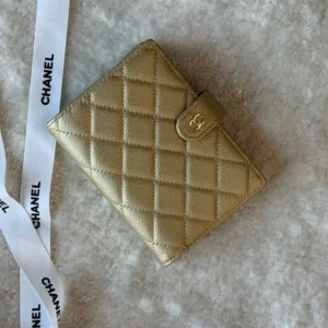 chanel 25s passport holder gold.webp
