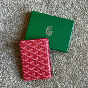 goyad passport holder burgundy.webp