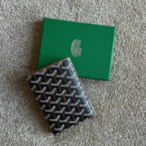 goyad passport holder black and tan.webp